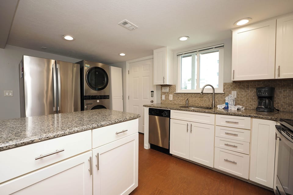 Your fully equipped kitchen features granite countertops, stainless steel appliances, and everything you need to create memorable meals during your stay.