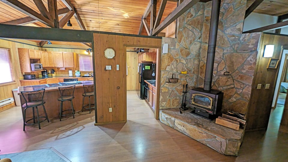 Left of the front door, wood burning wood stove, kitchen