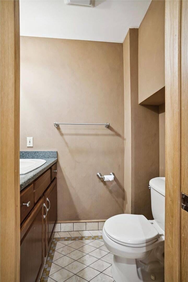 Bathroom Vanity Area - A practical and convenient space for getting ready, with ample room for daily essentials.