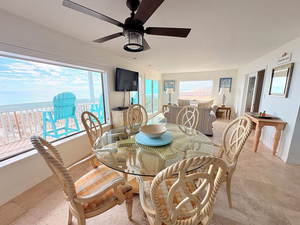Gather around your stunning oceanfront dining table where nautical charm meets breathtaking views, creating the perfect setting for memorable meals together.