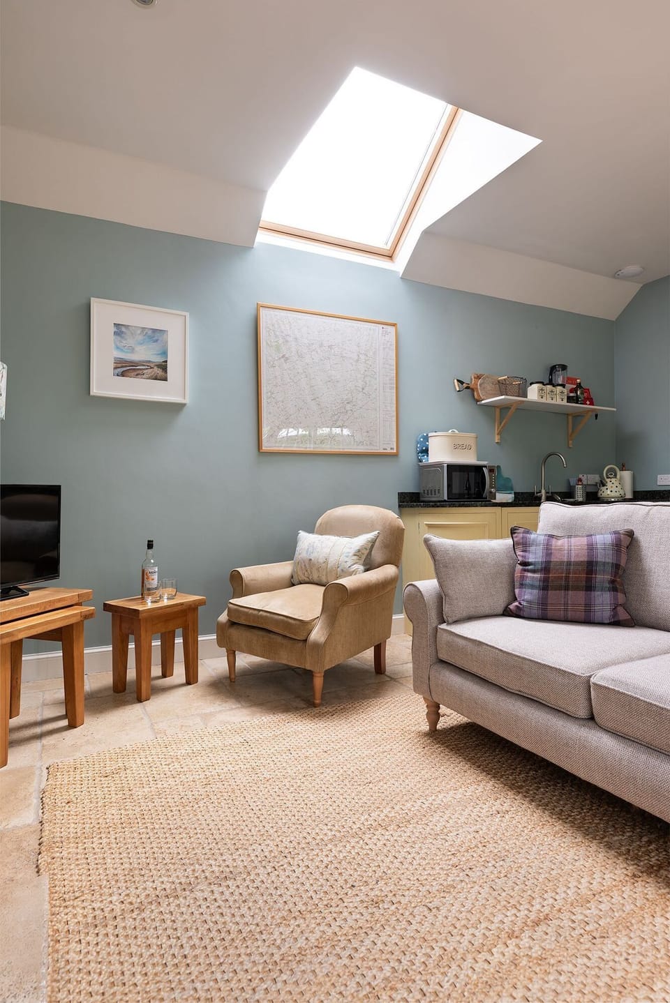 The Heritage - seating area with sofa, armchair and TV