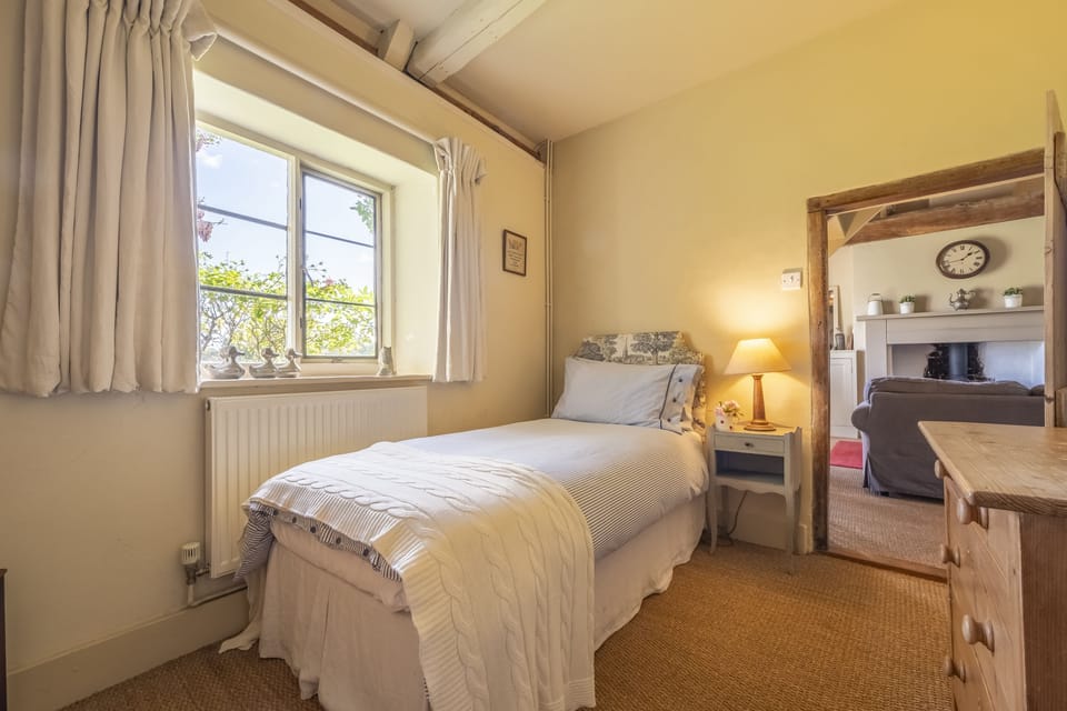 Dressing room with a single bed