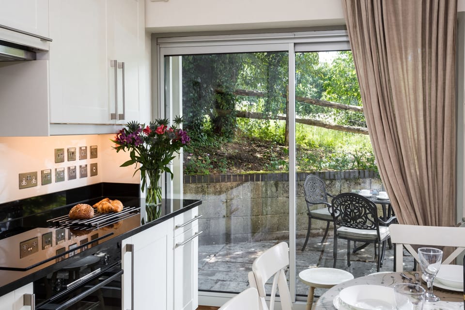 Sliding doors in the kitchen provide access to the patio where you can enjoy your morning coffee