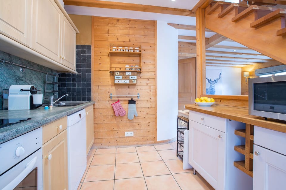 Fully equipped kitchen area for preparing meals at home.
