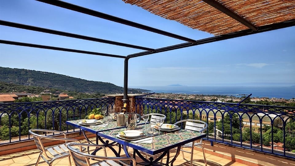 Your large private terrace, with a table and chairs, deckchairs and amazing panoramic views of the Gulf of Sorrento