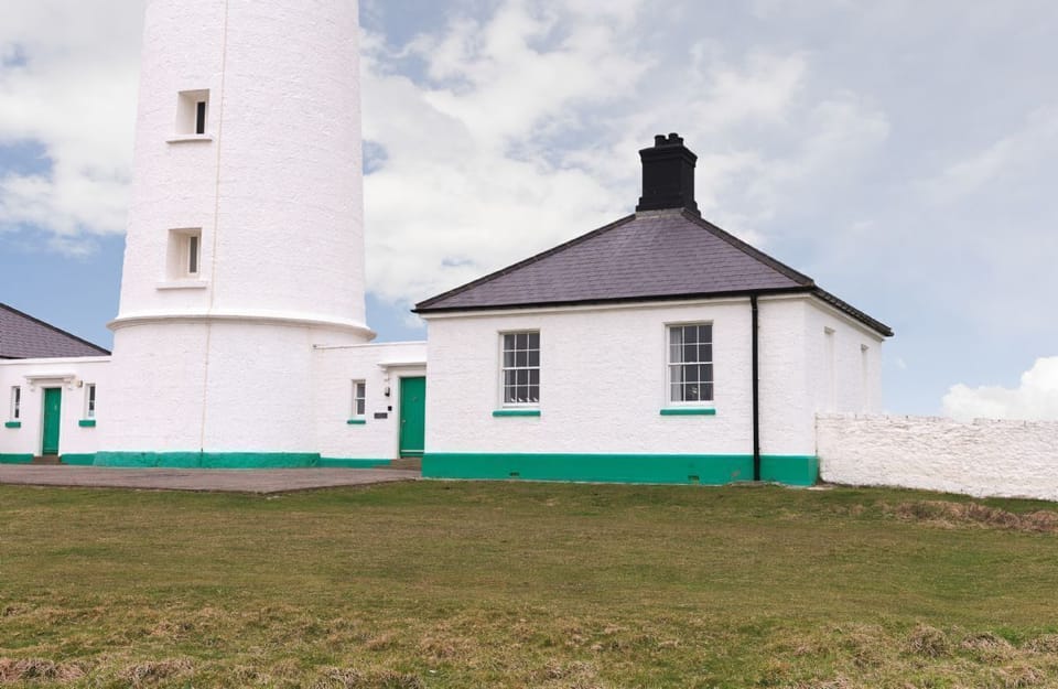 Stella Cottage is to the right hand side of the tower