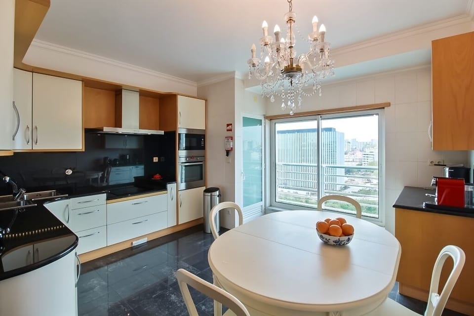20. Haven in Lisbon. Kitchen. Washer & Ariel. Dryer. Steam Iron & Ironing board.