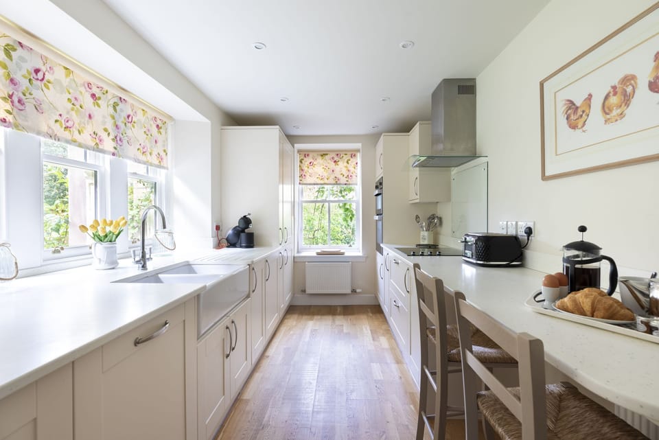 Monteviot Stables West - the kitchen with breakfast bar seating and garden views