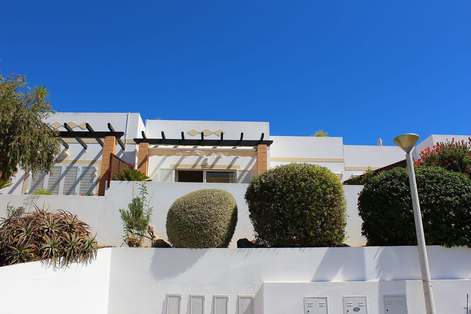 House front with car parking in front