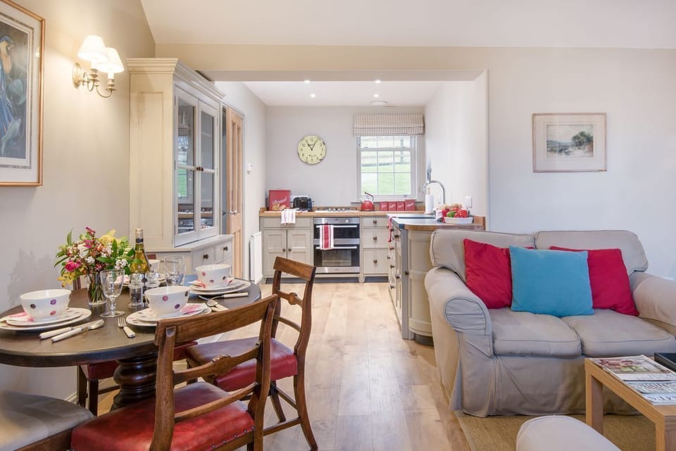 Barley Hill Cottage - open-plan living space with handmade Chalon-style kitchen and dining space for four guests