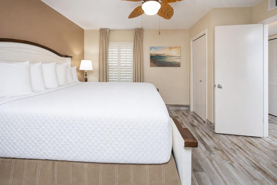 Rest deeply after beach days in this king suite surrounded by fluffy pillows
