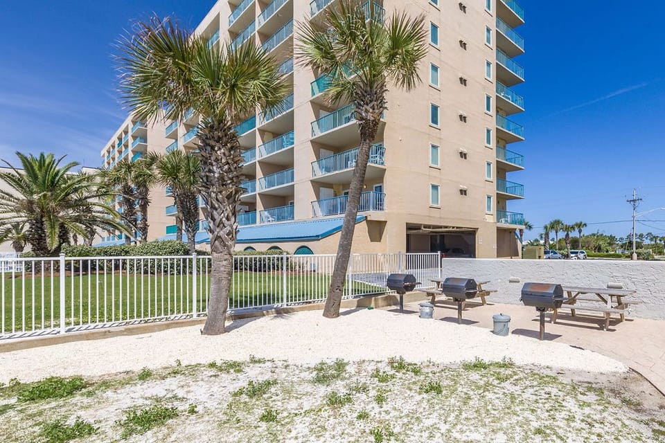 Discover this beachfront property with palm trees, grilling areas, and a welcoming atmosphere for your perfect getaway