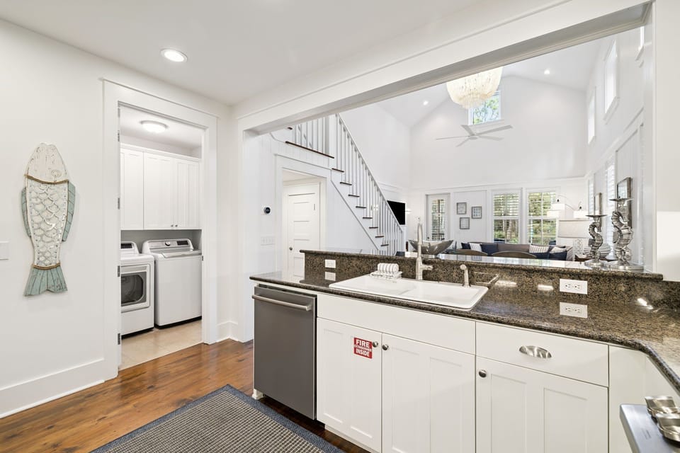 Your spacious kitchen features granite counters, modern appliances, and an open layout connecting to the bright living area.