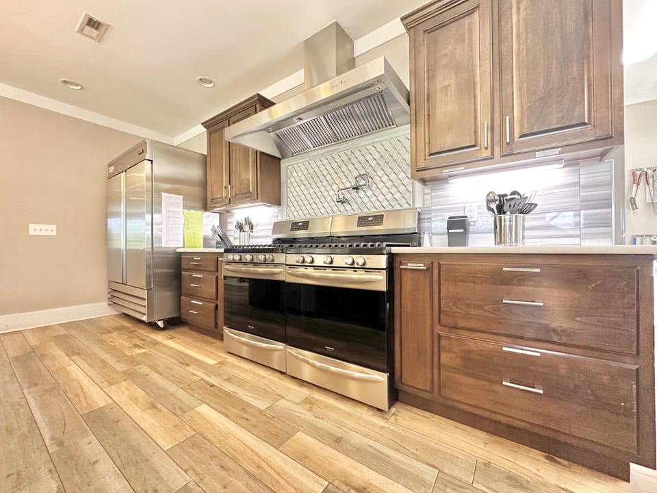 10 burners, commercial hood, double commercial fridge, 2 microwaves and 2 d/w's.