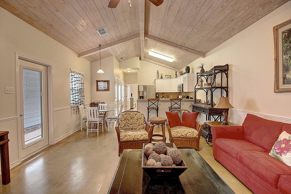 You'll love this open-concept living space where rustic wood beams meet modern comfort, creating your perfect home away from home.