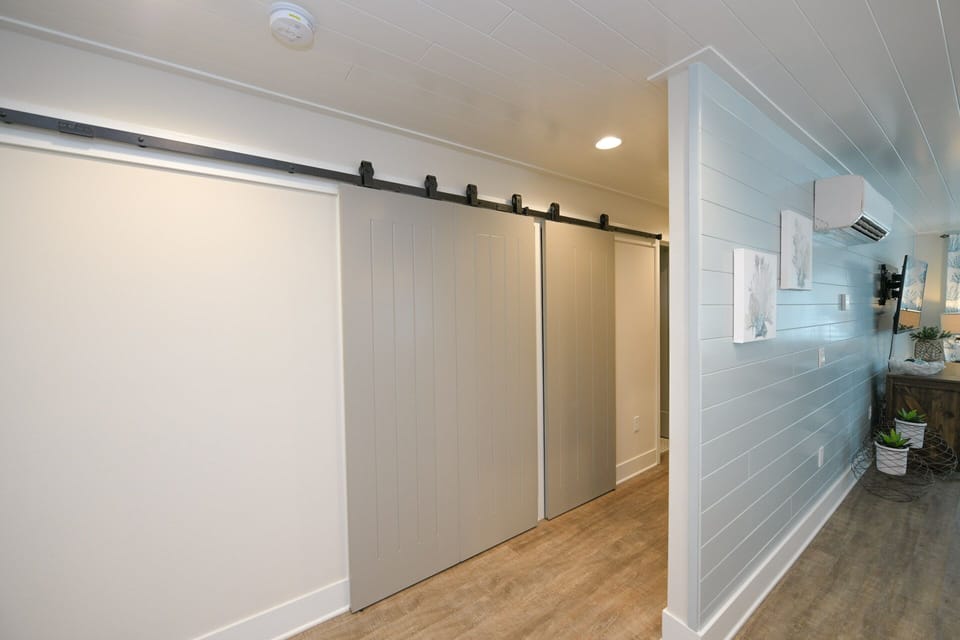 Hallway to Bedrooms. Behind Barndoor is Future Laundry
