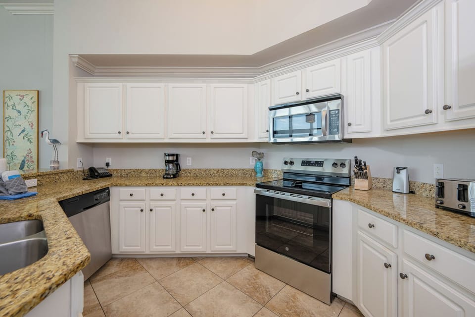 Craft delicious meals in your kitchen with ample counter space, all while enjoying the inviting coastal vibe