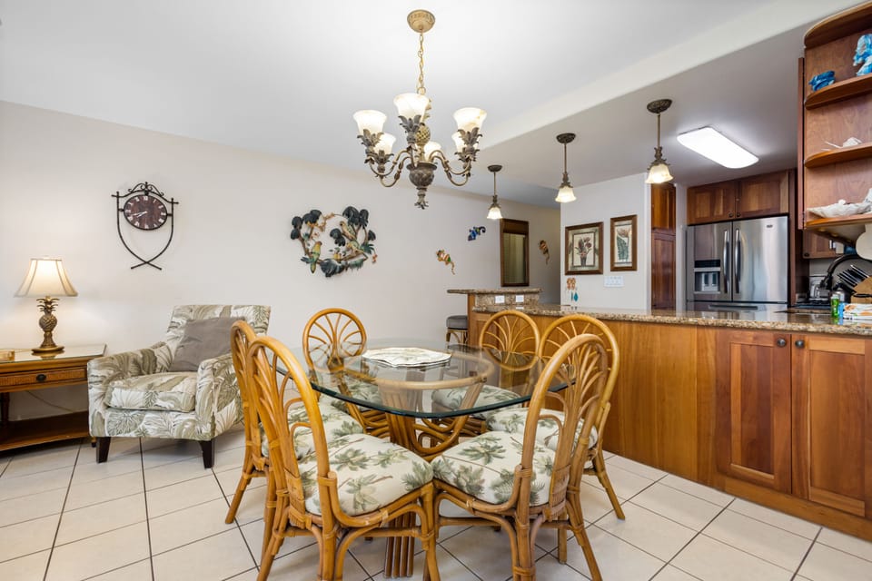 You'll love gathering around the glass-top dining table, with the fully equipped kitchen just steps away and cozy seating perfect for relaxing after your island adventures.