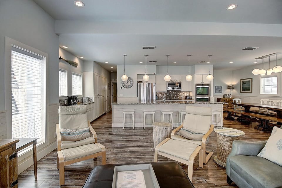 Indoor - The kitchen, dining, and living areas blend seamlessly for a bright and airy feel