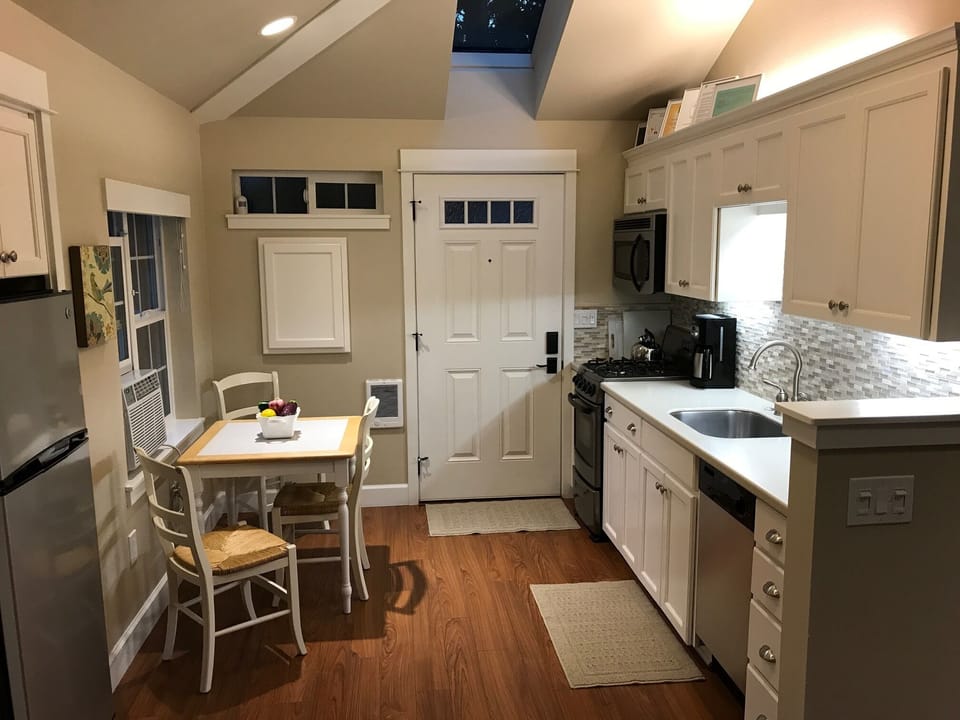 Four burner gas stove/oven, microwave, refrigerator, ice maker and Bosch DW