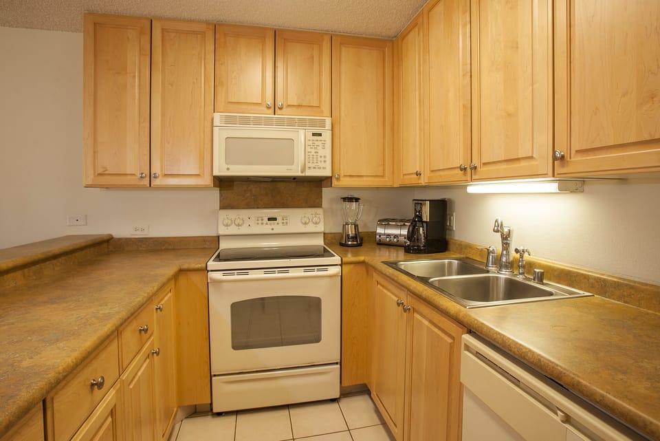 A fully equipped kitchen with ample counter space, modern appliances, and everything you need to prepare your favorite meals during your stay.