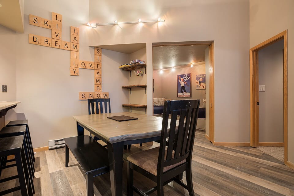 Gather around your dining table for meals and memories, with charming word art and warm lighting creating the perfect atmosphere.