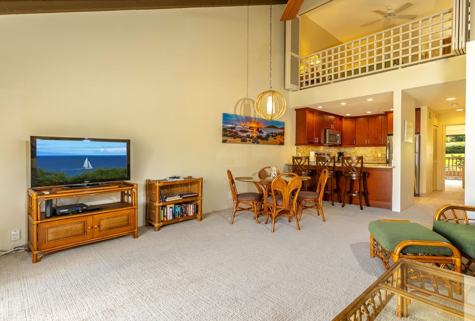Unwind in your spacious open-plan living area with ocean-view TV, tropical dining space, and loft above. The fully-equipped kitchen invites easy meal prep while you soak in the island ambiance.