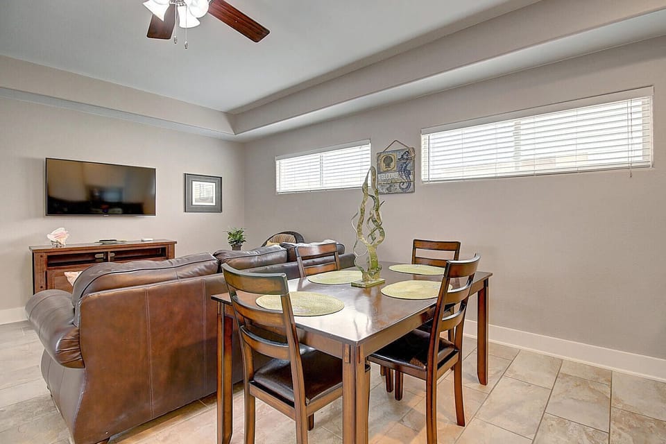 Gather around your elegant dining table with warm wood tones and comfortable seating for six, perfect for memorable meals together.