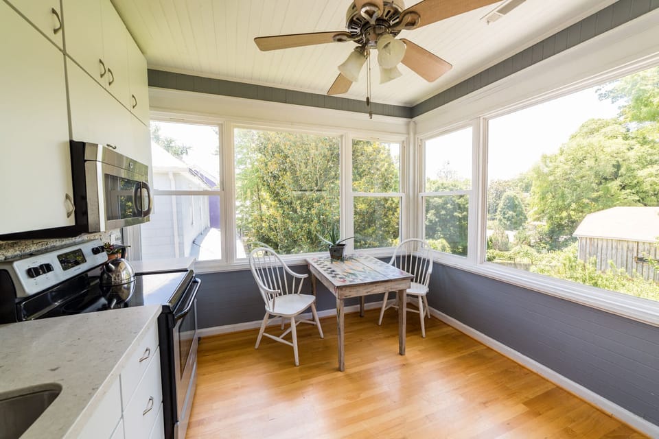 Kitchen features granite counters, stainless steel appliances, glass & charm.