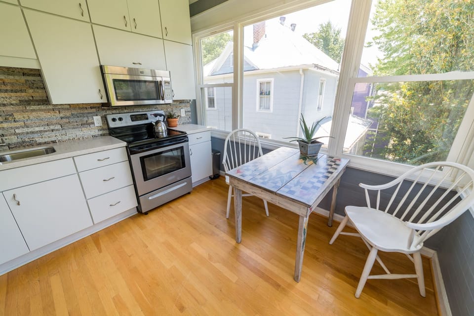 Half of the kitchen is windows, offering light & views