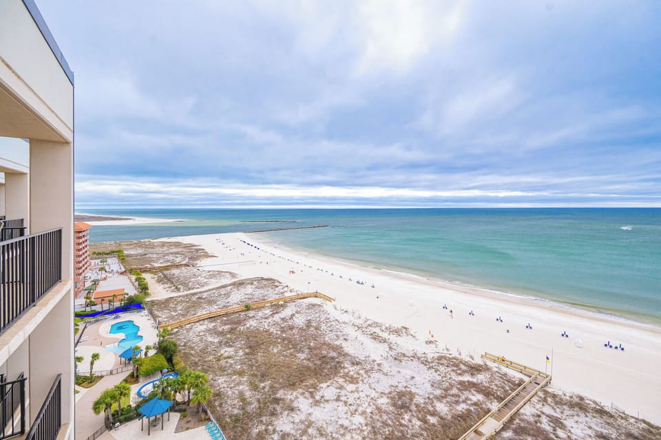 Gaze out from your balcony, savoring serene coastal views and the gentle sounds of the beach all around you