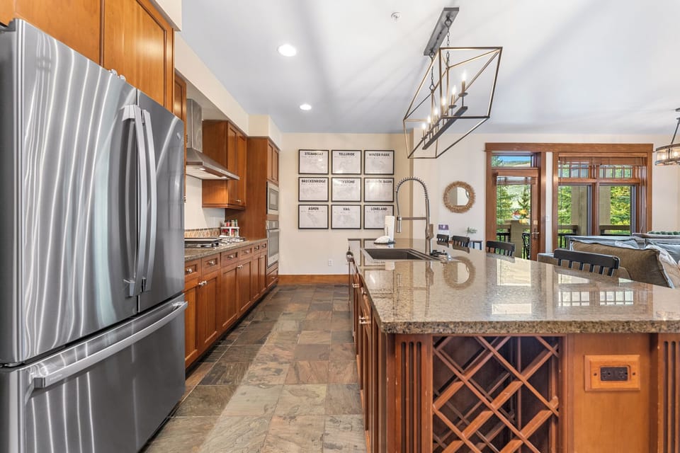 Your gourmet kitchen features granite countertops, stainless steel appliances, and a spacious island perfect for cooking memorable meals together.