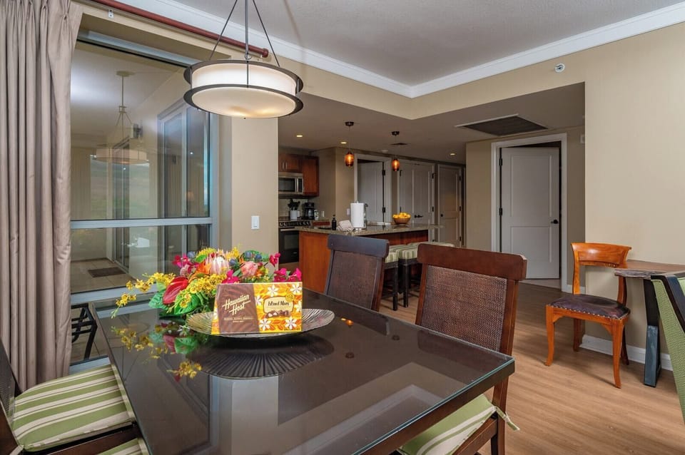 The open dining area connects seamlessly to your fully equipped kitchen, perfect for home-cooked meals or island takeout enjoyed with family.
