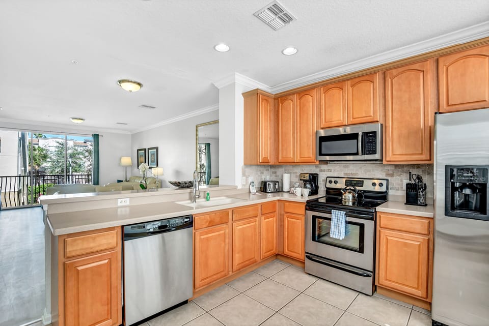Experience Culinary Delight: Our fully equipped kitchen boasts an open-concept design, flooded with natural light from the outside, making meal preparation a delightful experience.