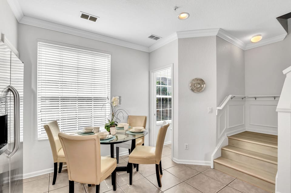 Intimate Dining Experience: Gather around this cozy dining table for four, perfect for enjoying meals with loved ones and creating lasting memories.