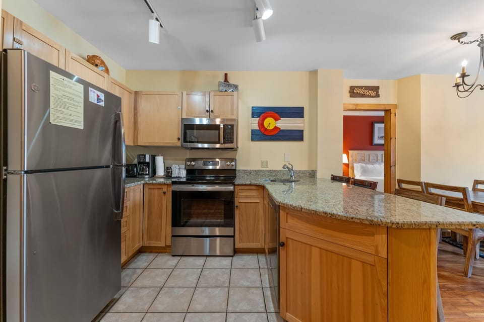 Cook your favorite meals in this fully equipped kitchen with granite counters, stainless steel appliances, and breakfast bar seating.