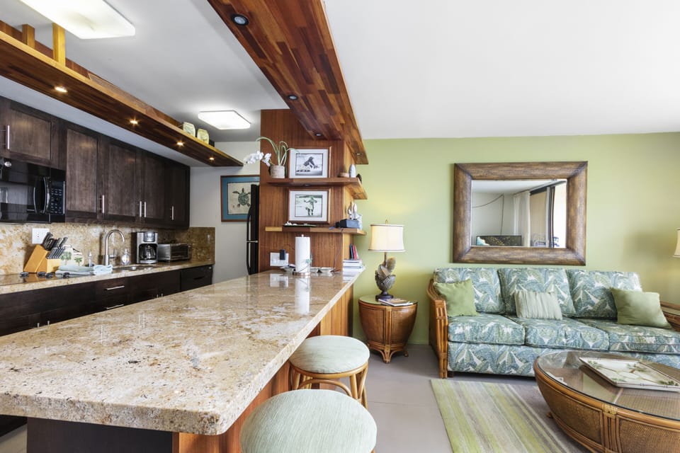 Unwind in this bright, open living space where the fully-equipped kitchen flows seamlessly into your cozy lounge area—perfect for relaxing after a day of adventure.