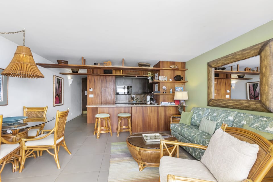 Step into your tropical retreat with island-inspired furnishings and natural wood throughout. The open kitchen invites you to prepare meals while staying connected to the cozy living area.