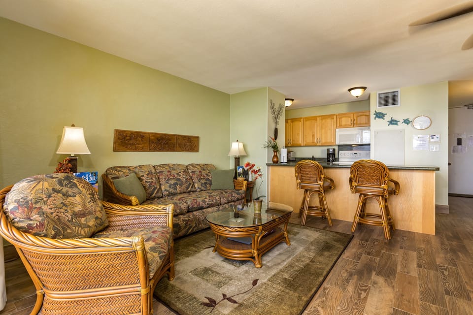 Relax in your comfortable living space with island-inspired decor, or pull up a seat at the breakfast bar in your fully-equipped kitchen—perfect for preparing meals during your stay.