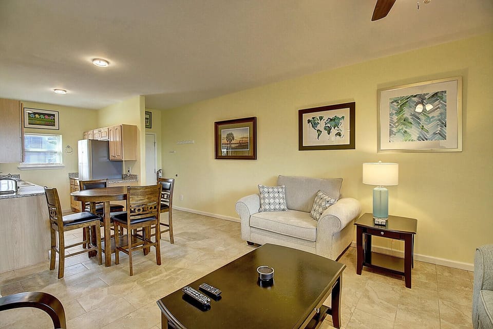 Your open-concept living space flows seamlessly from kitchen to cozy seating, perfect for unwinding after exploring.