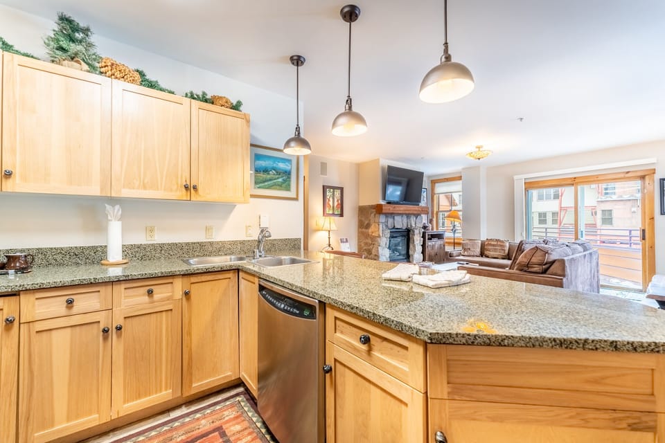 Your fully equipped kitchen flows seamlessly into the cozy living space, perfect for preparing meals while staying connected with loved ones.