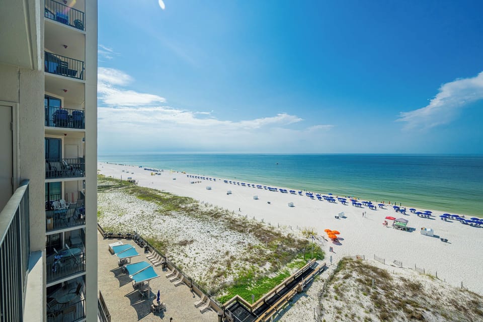 Enjoy stunning views from your balcony, where you can relax and take in the beauty of the tranquil waters and beach below