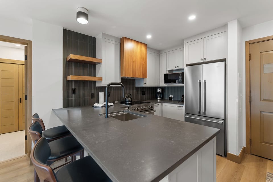 Your fully equipped kitchen features modern appliances and sleek countertops, perfect for preparing meals during your stay.