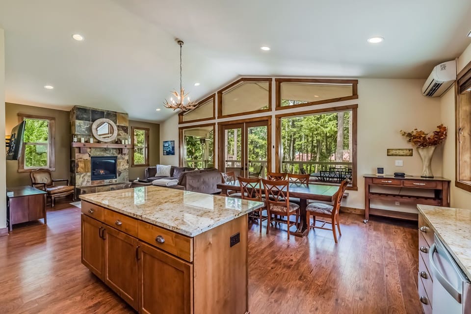 Enjoy the floor to ceiling windows from the kitchen and dining room