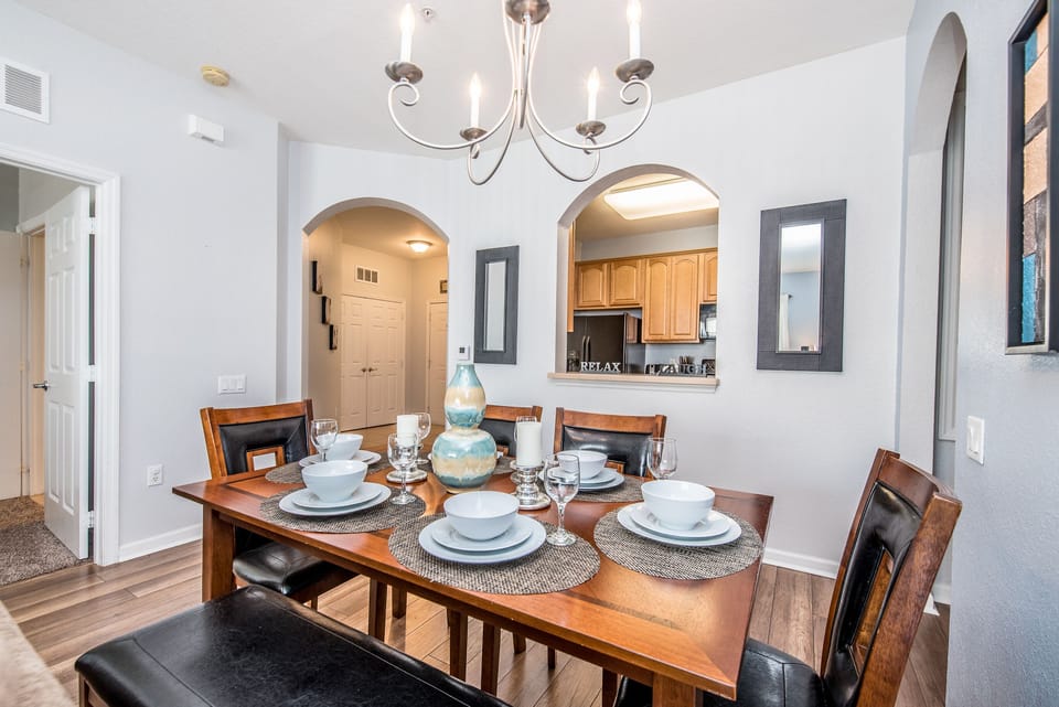 The dining area, conveniently situated next to the kitchen, offers the perfect setting to enjoy delicious meals with loved ones.