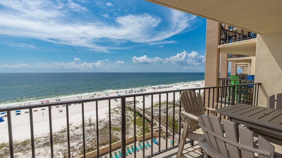 Enjoy breathtaking views from your private balcony, complete with comfortable seating and easy beach access