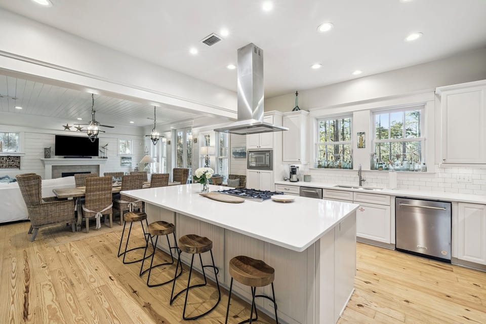 Gather around the spacious island in this bright, open kitchen where you'll create meals together and share stories over morning coffee.