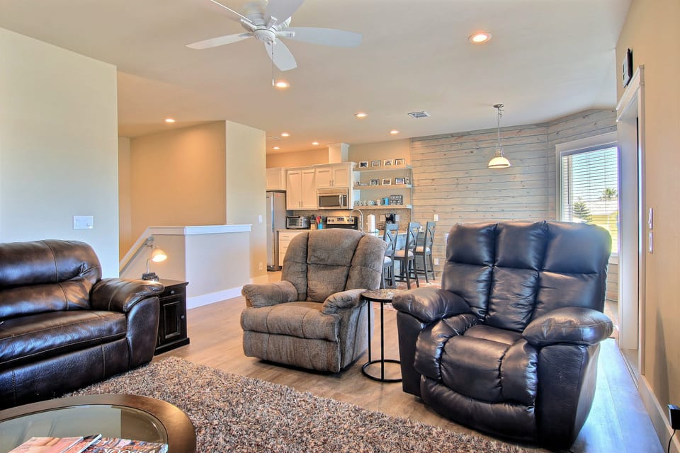 Living room - Inviting living room featuring plush seating creating a warm and sociable atmosphere ideal for family gatherings or game nights