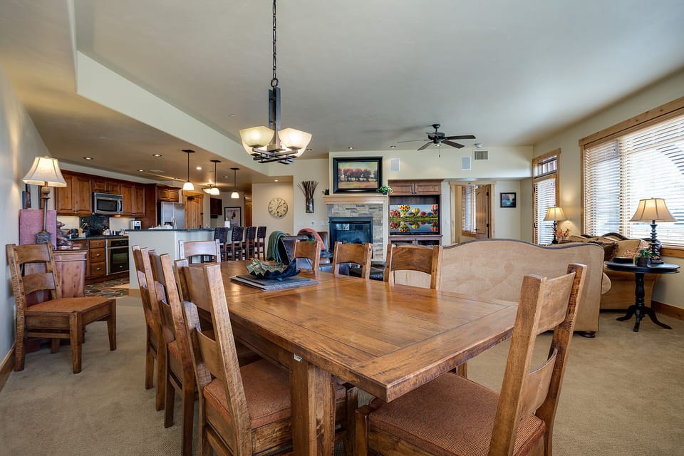 Gather around your spacious dining table while the chef prepares meals in the open kitchen and cozy fireplace warmth fills the room.