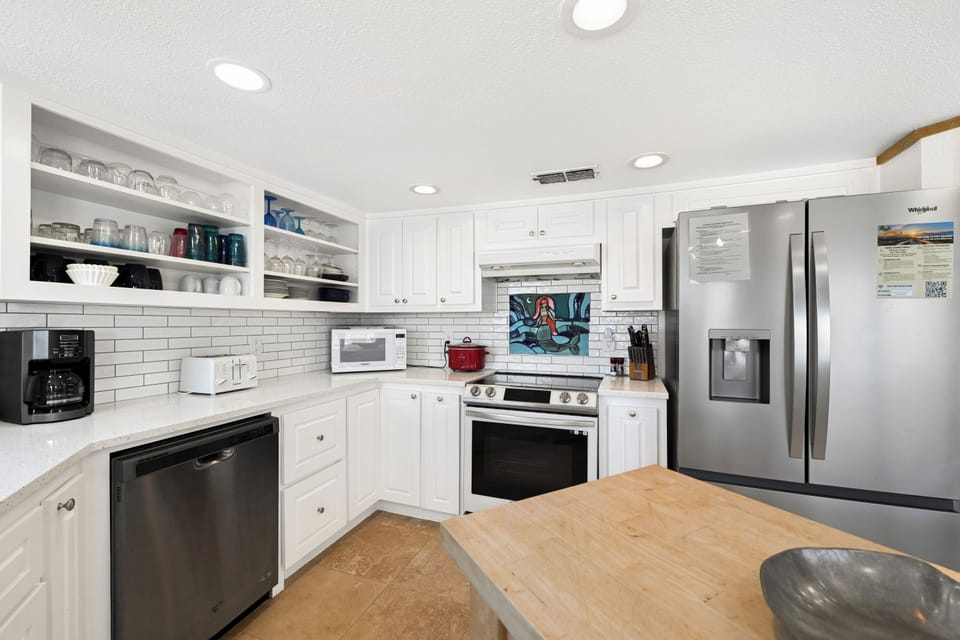 Your fully equipped kitchen features modern appliances, ample counter space, and everything you need to prepare delicious meals during your stay.